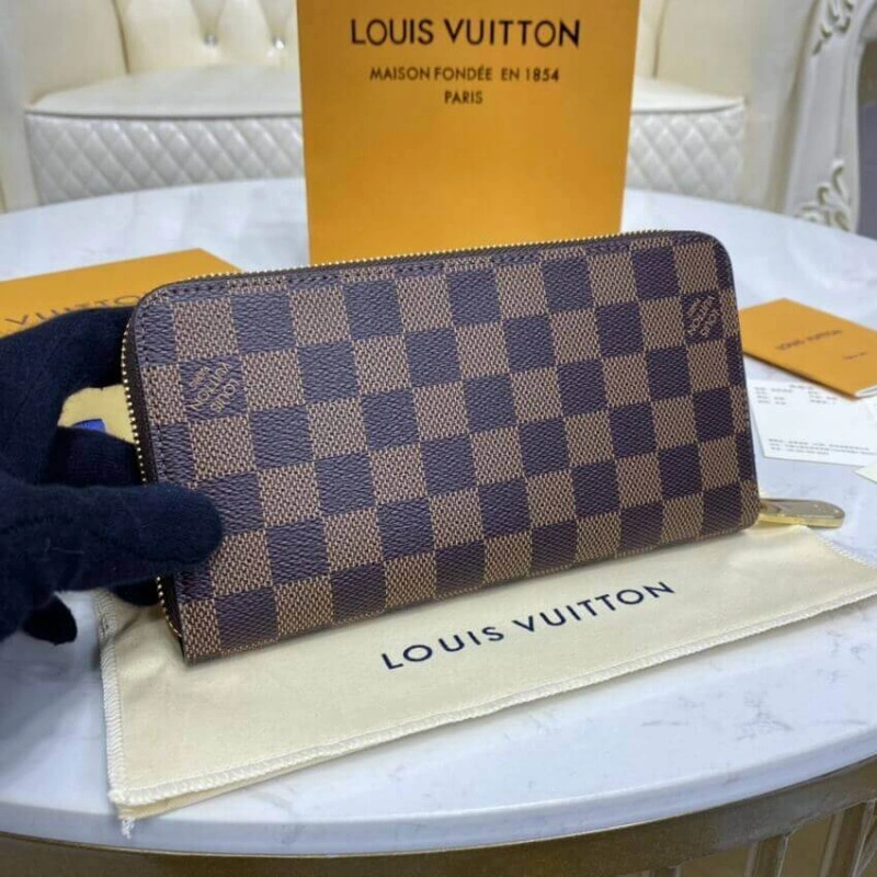 This iconi Louis Vuitton Damier Ebene Zippy Wallet Brown - Image 3