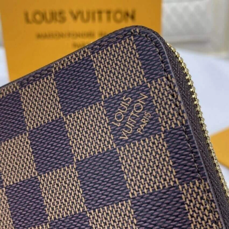This iconi Louis Vuitton Damier Ebene Zippy Wallet Brown - Image 4