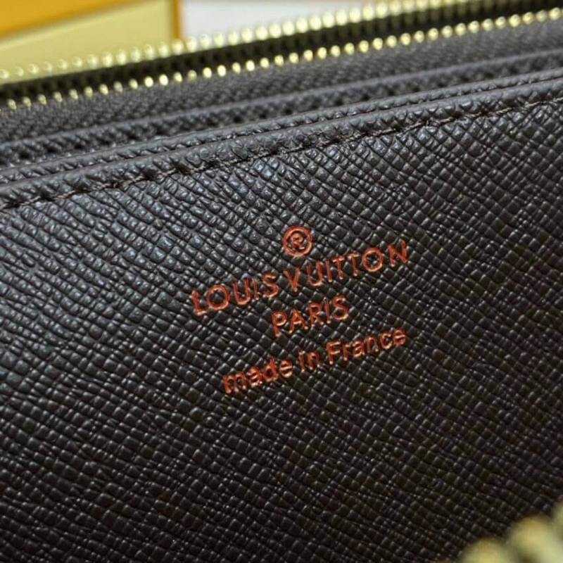 This iconi Louis Vuitton Damier Ebene Zippy Wallet Brown - Image 9